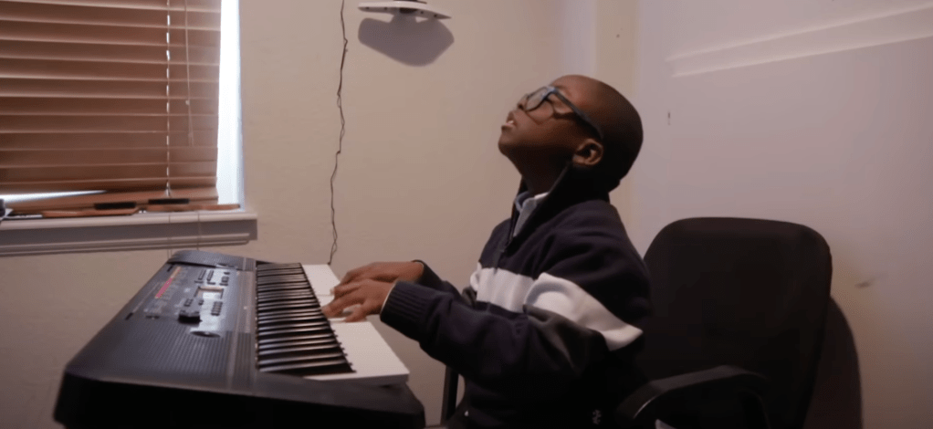 Child prodigy playing the piano. 